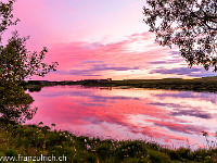 Sonnenuntergang in Hella am Fluss Ytri-Rangá. : Island